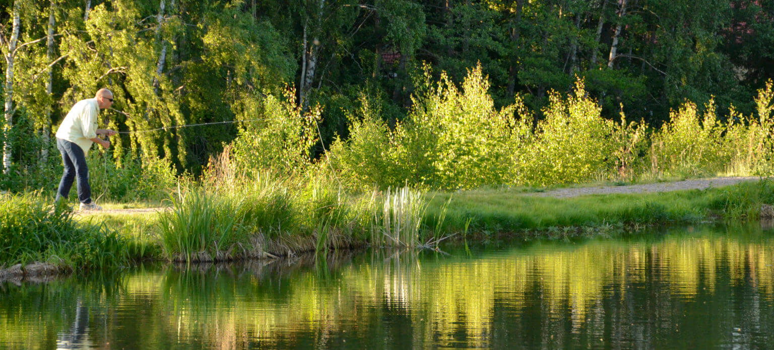 A person throwing the fishing line